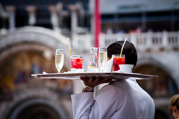 Open Letter Hospitality Industry waiter holding drink tray